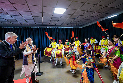 Prime Minister Narendra Modi observes a performance during a community programme, in The Hague, Netherlands. 