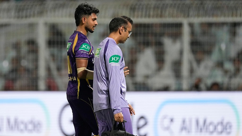 Matheesha Pathirana (left) leaves the field after getting injured during the Indian Premier League match between Gujarat Titans and Kolkata Knight Riders in Kolkata. - AP/Bikas Das