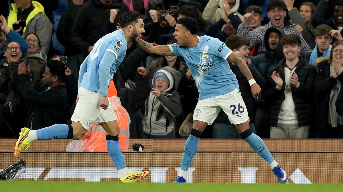 Manchester City's Savinho, right, celebrates with Manchester City's Rayan Cherki after scoring his side's third goal during the English Premier League soccer match between Manchester City and Crystal Palace in Manchester, England, Wednesday, May 13, 2026.  - | Photo: AP/Ian Hodgson