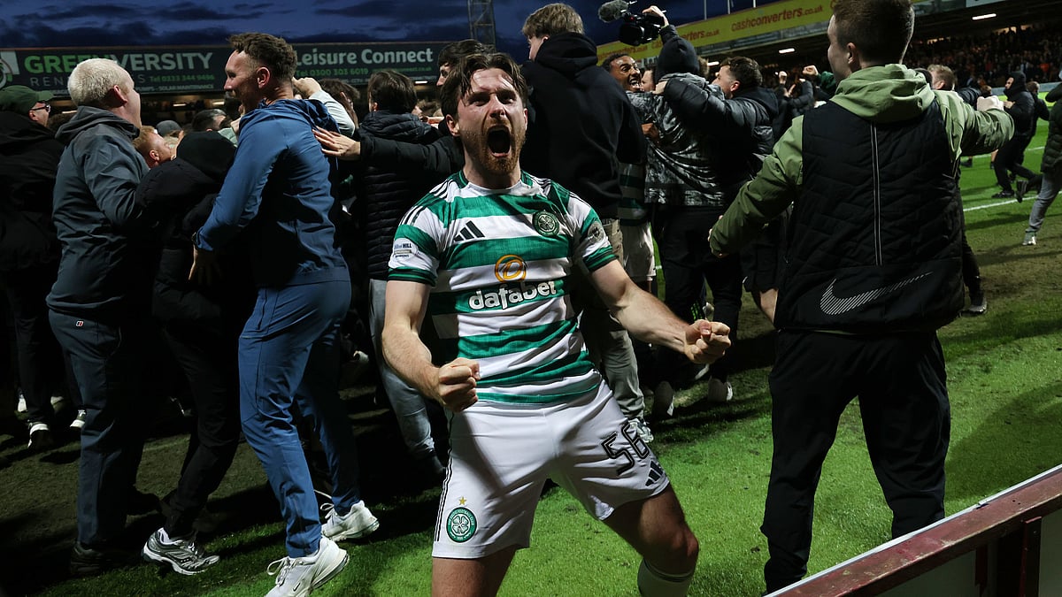 Celtic's Anthony Ralston celebrates after Kelechi Iheanacho scores their side's third goal from a penalty during the Scottish Premiership soccer match between Motherwell and Celtic, Wednesday, May 13, 2026, in Motherwell, Scotland.  - | Photo: AP/Robert Perry