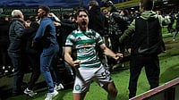 Celtic Vs Hearts LIVE Streaming, Scottish Premiership: When, Where To Watch SPL Title Decider? | Photo: AP/Robert Perry : Celtic's Anthony Ralston celebrates after Kelechi Iheanacho scores their side's third goal from a penalty during the Scottish Premiership soccer match between Motherwell and Celtic, Wednesday, May 13, 2026, in Motherwell, Scotland.
