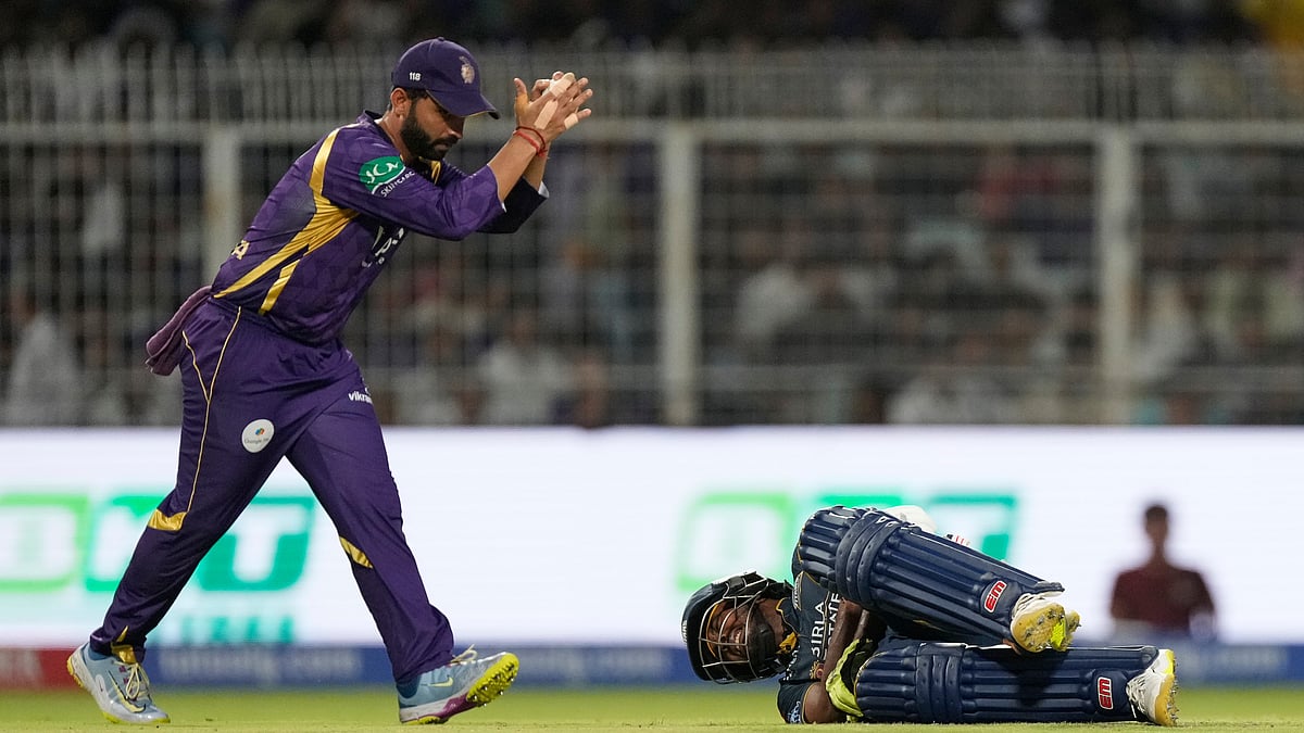 Gujarat Titans batter Sai Sudharsan lies on the ground after being struck on the hand by the ball while attempting a shot, as Kolkata Knight Riders captain Ajinkya Rahane watches during the Indian Premier League cricket match between Gujarat Titans and Kolkata Knight Riders, in Kolkata , India, Saturday, May 16, 2026.  - (AP Photo/Bikas Das)