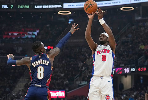 Detroit Pistons' Caris LeVert, right, shoots over Cleveland Cavaliers' Dennis Schroder, left, in the first half of Game 6 of a second-round NBA basketball playoffs series in Cleveland.