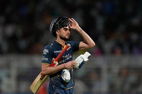 Gujarat Titans' captain Shubman Gill reacts while leaves the ground after losing his wicket during the Indian Premier League cricket match between Gujarat Titans and Kolkata Knight Riders, in Kolkata.
