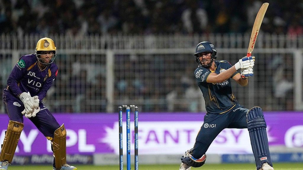 Shubman Gill (right) hits a six during the Indian Premier League match between Gujarat Titans and Kolkata Knight Riders in Kolkata. - AP/Bikas Das