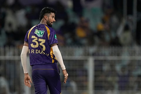 Kolkata Knight Riders' Saurabh Dubey celebrates the wicket of Gujarat Titans' Jos Buttler during the Indian Premier League cricket match between Gujarat Titans and Kolkata Knight Riders, in Kolkata.