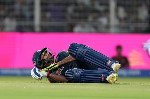 Gujarat Titans batter Sai Sudharsan lies on the ground after being struck on the hand by the ball while attempting a shot during the Indian Premier League cricket match between Gujarat Titans and Kolkata Knight Riders, in Kolkata.