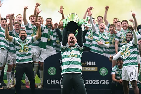 Celtic coach Shaun Maloney with the Scottish Premier League Trophy following his side's title deciding match against Heart of Midlothian at Celtic Park, in Glasgow, Scotland.