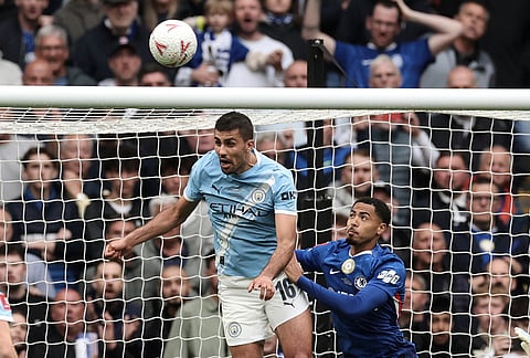Manchester City's Rodrigo, left, and Chelsea's Levi Colwill challenge for the ball during the English FA Cup final soccer match between Chelsea and Manchester City in London.