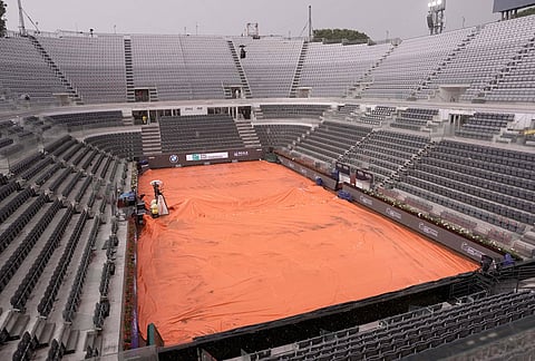 A view of the empty central court as the semifinal match between Casper Ruud of Norway and Luciano Darderi was suspended due to heavy rain, at the Italian Open tennis tournament in Rome.