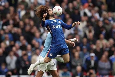 Chelsea's Marc Cucurella, front, and Manchester City's Matheus Nunes challenge for the ball during the English FA Cup final soccer match between Chelsea and Manchester City in London.