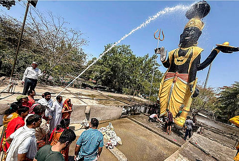 People perform a ritual on 'Shani Jayanti', in Bhopal, Madhya Pradesh.
