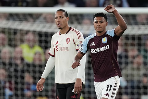 Aston Villa's Ollie Watkins, right, celebrates after scoring his side's second goal during the English Premier League soccer match between Aston Villa and Liverpool in Birmingham, England.