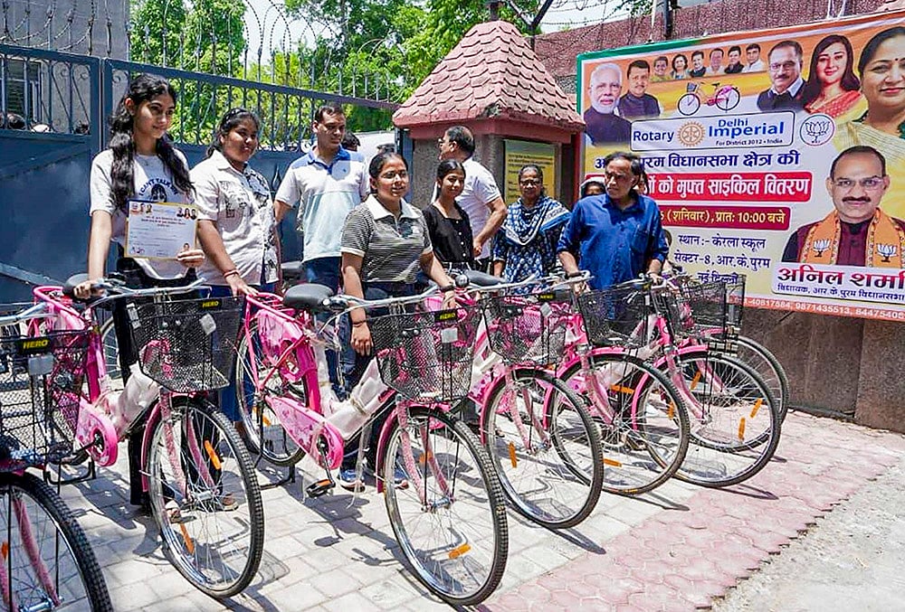 Delhi CM Rekha Gupta distributes bicycles