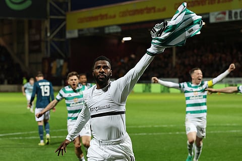 Celtic's Kelechi Iheanacho celebrates scoring their side's third goal from a penalty during the Scottish Premiership soccer match between Motherwell and Celtic in Motherwell, Scotland. 