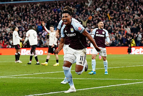 Aston Villa's Ollie Watkins celebrates scoring their side's third goal during the English Premier League soccer match between Aston Villa and Liverpool in Birmingham, England.
