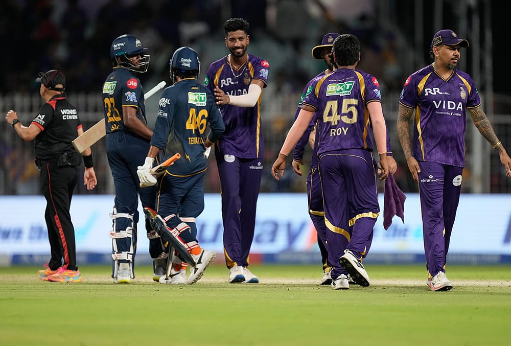 Gujarat Titans' Sai Sudharsan, left, and Rahul Tewatia greet Kolkata Knight Riders players after Kolkata Knight Riders defeated Gujarat Titans in their Indian Premier League cricket match in Kolkata. - | Photo: AP/Bikas Das
