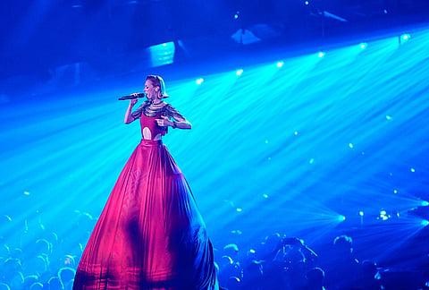 Aliona Moon sings "Viva Moldova" during her featured performance with Satoshi from Moldova during the dress rehearsal for the Grand Final of the 70th Eurovision Song Contest in Vienna, Austria.