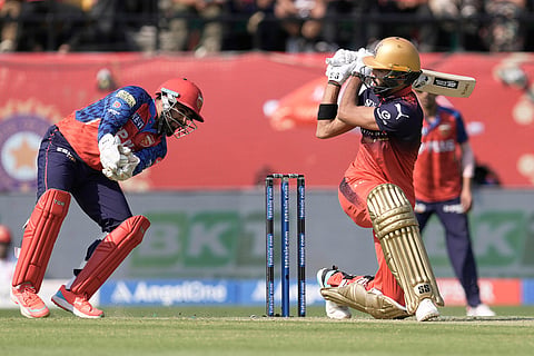 Royal Challengers Bengaluru's Devdutt Padikkal plays a shot during the Indian Premier League cricket match between Punjab Kings and Royal Challengers Bengaluru in Dharamshala, India.