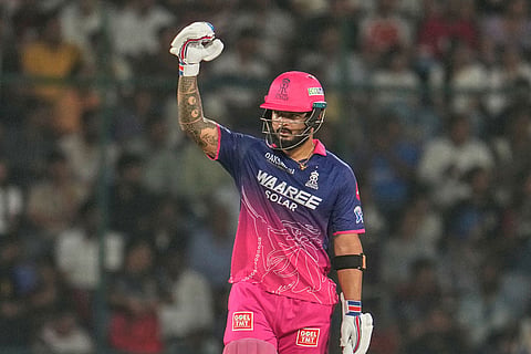 Rajasthan Royals' captain Riyan Parag celebrates his fifty runs during the Indian Premier League cricket match between Delhi Capitals and Rajasthan Royals in New Delhi, India.