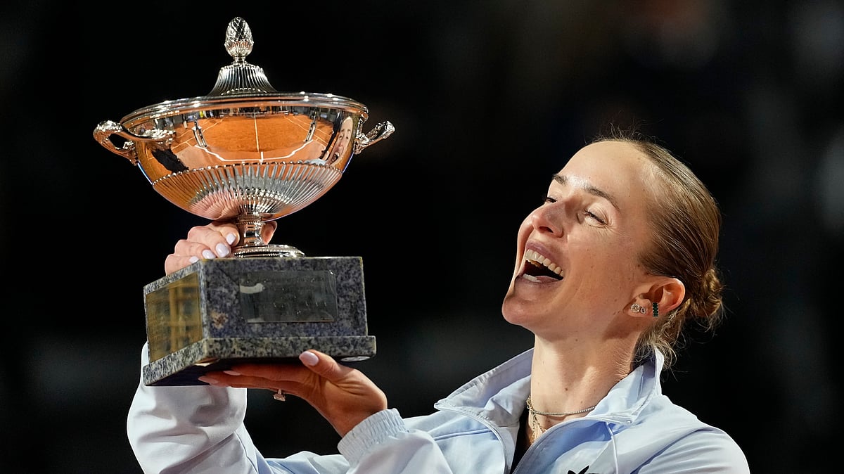 Ukraine's Elina Svitolina kisses the trophy after winning against United States' Coco Gauff at the end of the women's final match. - AP