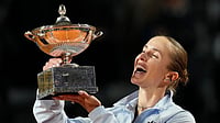 AP : Ukraine's Elina Svitolina kisses the trophy after winning against United States' Coco Gauff at the end of the women's final match.