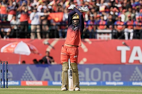 Royal Challengers Bengaluru's Venkatesh Iyer celebrates his fifty runs during the Indian Premier League cricket match between Punjab Kings and Royal Challengers Bengaluru in Dharamshala, India.