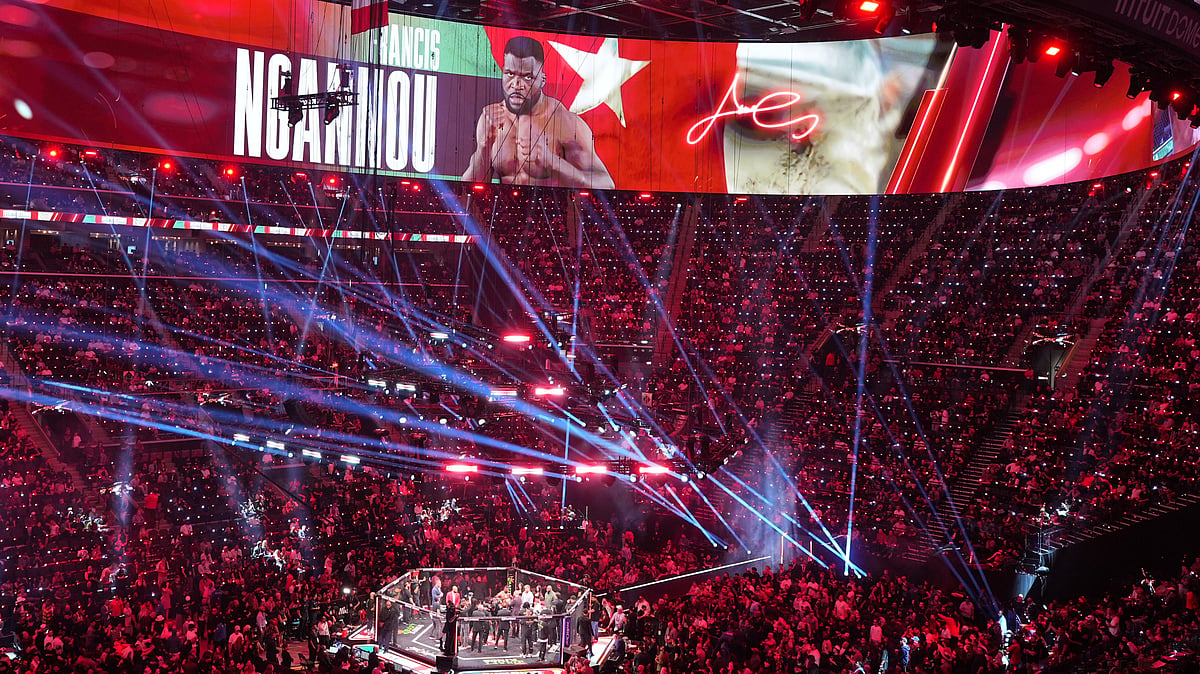 Graphics for Francis Ngannou, of Cameroon, are displayed as he celebrates after defeating Philipe Lins, of Brazil, in their heavyweight mixed martial arts fight. - AP/Jae C. Hong