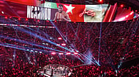 AP/Jae C. Hong : Graphics for Francis Ngannou, of Cameroon, are displayed as he celebrates after defeating Philipe Lins, of Brazil, in their heavyweight mixed martial arts fight.