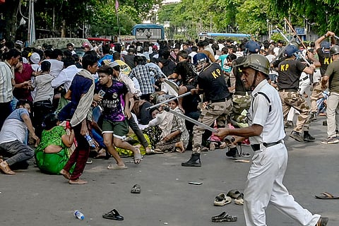 Police lathicharge protestors during protest against a recent demolition drive at Tijala area among other issues, at Park Circus area, in Kolkata.
