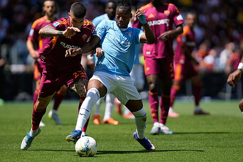 Roma's Gianluca Mancini, left, and Lazio's Tijjani Noslin challenge for the ball during the Italian Serie A soccer match between Roma and Lazio in Rome.