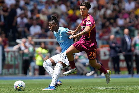 Roma's Paulo Dybala, right, and Lazio's Tijjani Noslin challenge for the ball during the Italian Serie A soccer match between Roma and Lazio in Rome.