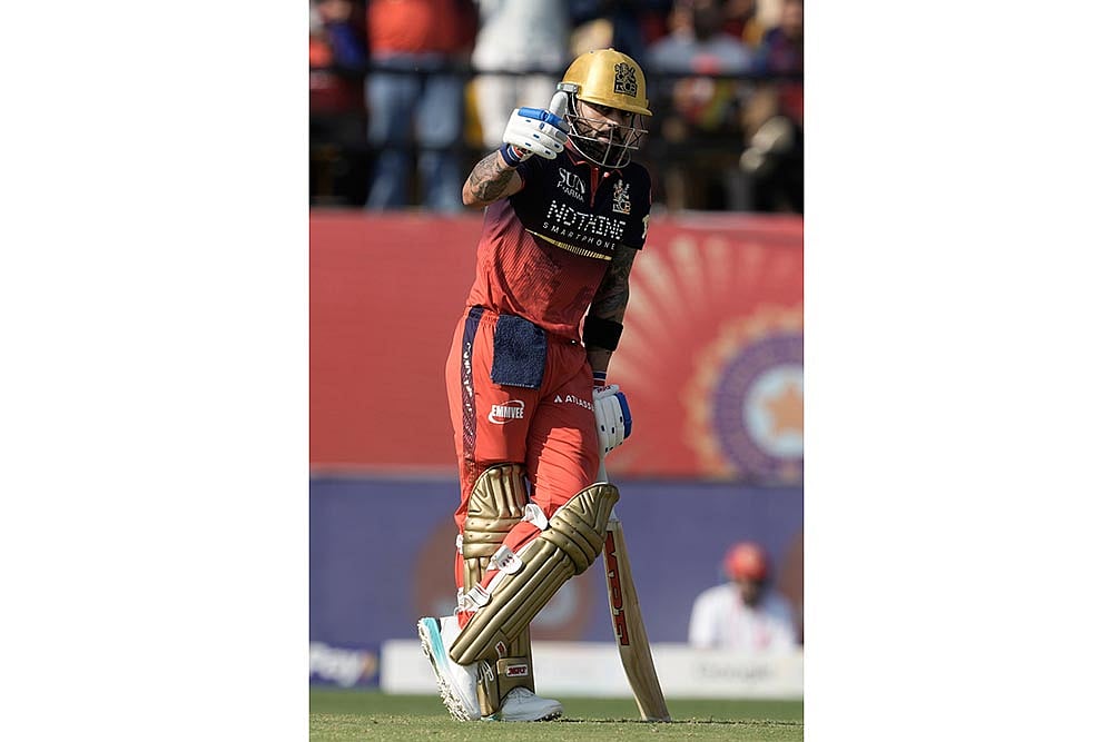 Royal Challengers Bengalurus Virat Kohli celebrates his fifty runs 