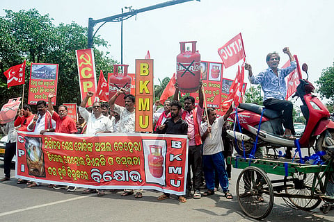 CPI supporters hold placards and posters during a demonstration over the hike in LPG and petrol prices, in Bhubaneshwar, Odisha.