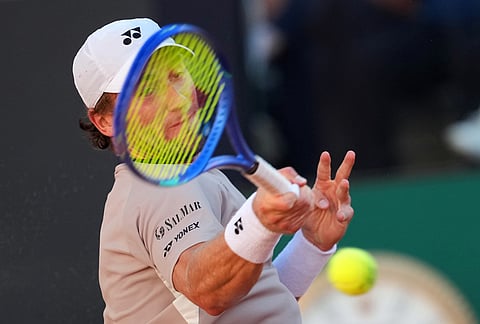 Casper Ruud, of Norway, returns the ball to Jannik Sinner, of Italy, during the final match at the Italian Open tennis tournament, in Rome.
