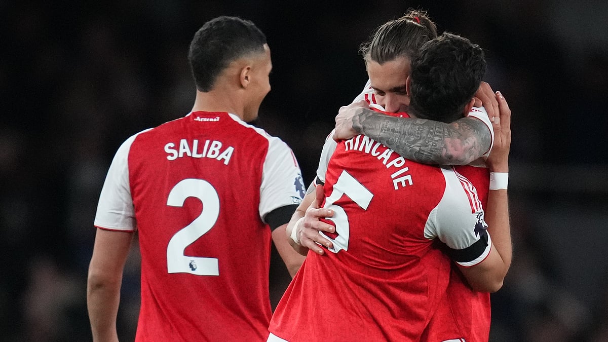 Arsenal's Riccardo Calafiori hugs Piero Hincapie after a Premier League soccer match between Arsenal and Burnley in London. - AP Photo