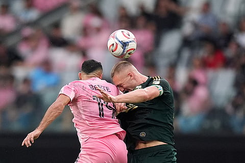 Portland Timbers defender Finn Surman, right, vies with Inter Miami forward German Berterame for a header during the second half of an MLS soccer match in Miami.