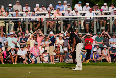 Aaron Rai, of England, putts on the 17th green during the final round of the PGA Championship golf tournament at Aronimink Golf Club, in Newtown Square, Pennsylvania.