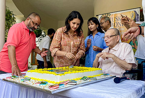 Author and poet Ruskin Bond cuts a cake on the eve of his 92nd birthday during a launch of his new book 'All-Time Favourite Friendship Stories', in Dehradun, Uttarakhand.