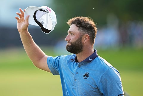 Jon Rahm, of Spain, acknowledges the gallery on the 18th green after his round during the final round of the PGA Championship golf tournament at Aronimink Golf Club, in Newtown Square, Pennsylvania.