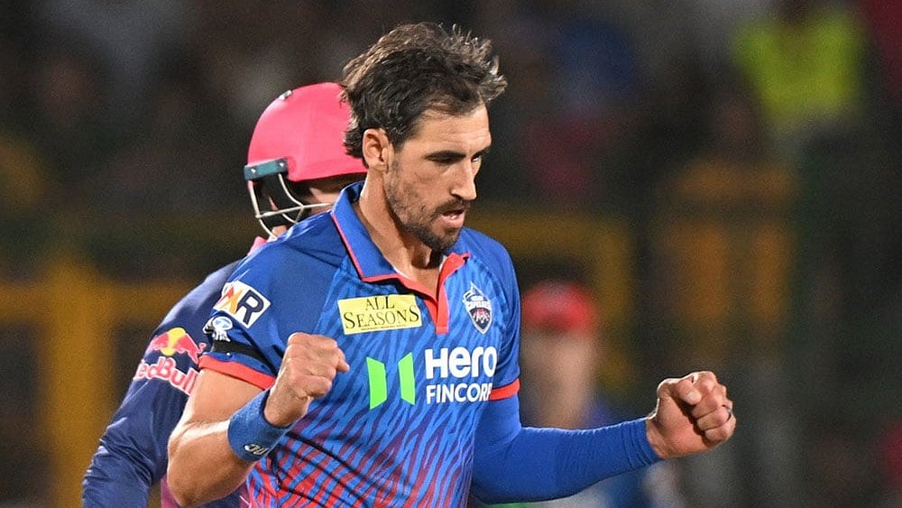 Delhi Capitals' Mitchell Starc celebrates the wicket of Rajasthan Royals' captain Riyan Parag during the Indian Premier League cricket match between Delhi Capitals and Rajasthan Royals in Jaipur, India. - | Photo: AP 