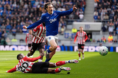 Sunderland's Nordi Mukiele, left, and Everton's Merlin Rohl in action during their English Premier League soccer match in Liverpool, England.
