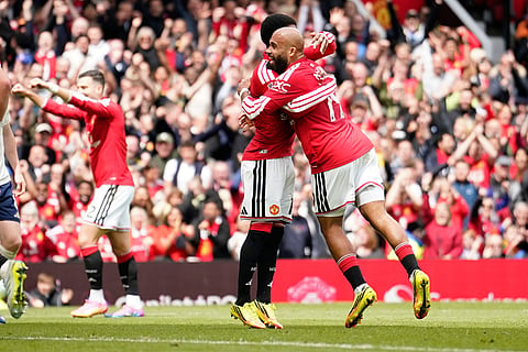 Manchester United's Bryan Mbeumo, right, celebrates after scoring his side's third goal during the English Premier League soccer match between Manchester United and Nottingham Forest in Manchester, England.