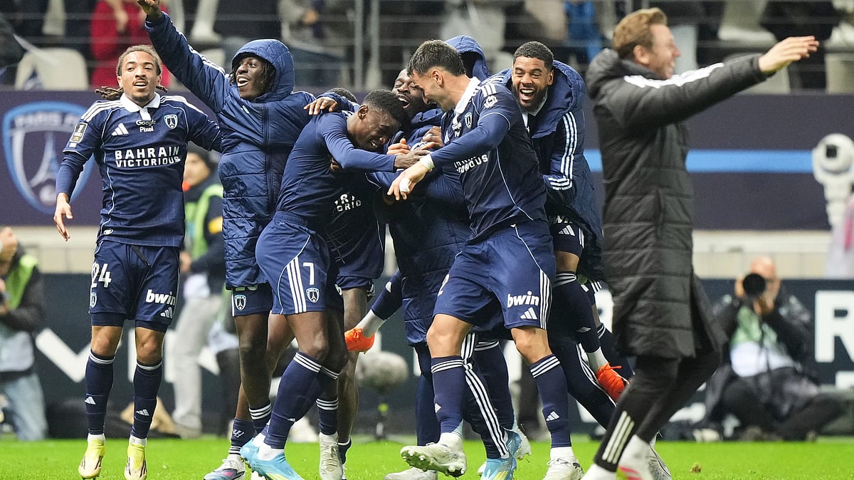 | Photo: AP/Michel Euler : Paris FC's Alimami Gory, centre left, celebrates with teammates after scoring his side's second goal during the French League One soccer match between Paris FC and Paris Saint-Germain in Paris, Sunday, May 17, 2026. 