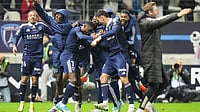 | Photo: AP/Michel Euler : Paris FC's Alimami Gory, centre left, celebrates with teammates after scoring his side's second goal during the French League One soccer match between Paris FC and Paris Saint-Germain in Paris, Sunday, May 17, 2026. 