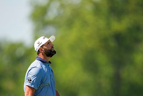 Jon Rahm, of Spain, looks upwards after a missed shot on the third hole during the final round of the PGA Championship golf tournament at Aronimink Golf Club, in Newtown Square, Pennsylvania.