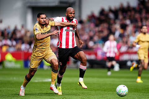 Crystal Palace's Maxence Lacroix, left, and Brentford's Igor Thiago battle for the ball during their English Premier League soccer match in London.