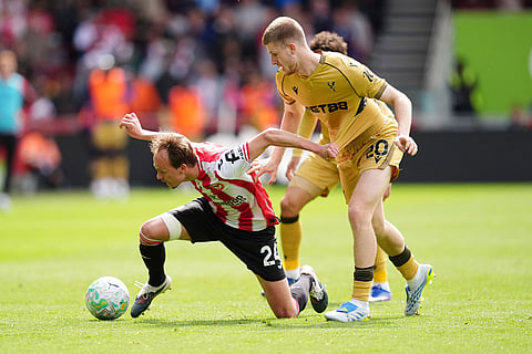 Brentford's Mikkel Damsgaard, left, and Crystal Palace's Adam Wharton during their English Premier League soccer match in London.