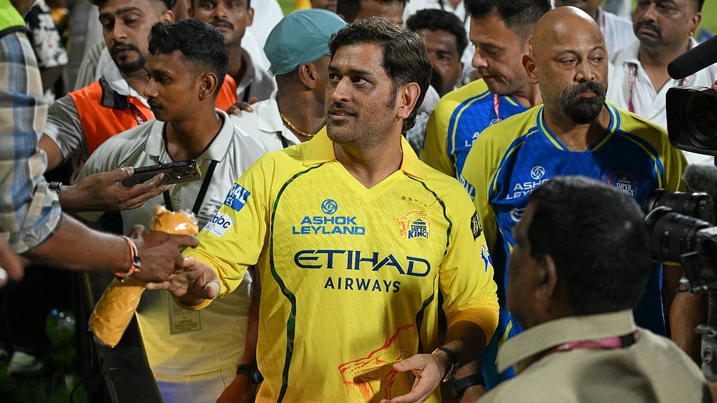 Chennai Super Kings' Mahendra Singh Dhoni with teammates greets his fans after the Indian Premier League match against Sunrisers Hyderabad in Chennai. - AP