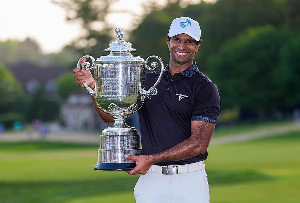 Aaron Rai, of England, holds the Wanamaker Trophy after winning the PGA Championship golf tournament at Aronimink Golf Club in Newtown Square, Pennsylvania. - | Photo: AP/Matt Slocum